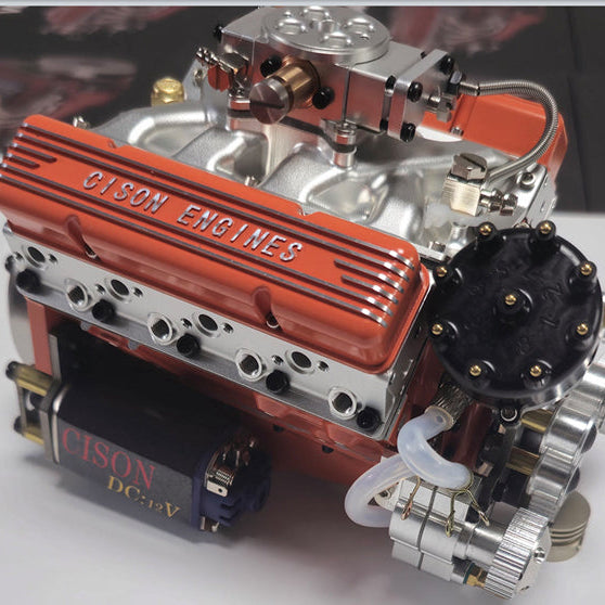 CISON miniature V8 engine model viewed from the flywheel side with visible exhaust headers and ignition components